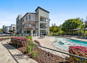 Thumbnail 34 of 72 - Building Exterior With Pool at Radius on Grove, Austin