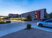 Thumbnail 8 of 37 - a parking lot with a car parked in front of a building at Republic at Alamo Heights, Texas, 78209