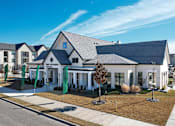 Thumbnail 3 of 25 - a white house with a gray roof and a sidewalk at The Fitzroy San Marcos, San Marcos