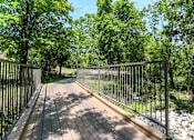 Thumbnail 56 of 72 - a wooden deck with a metal railing at Radius on Grove, Austin, 78741