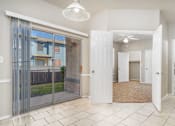 Thumbnail 24 of 35 - Entryway with tile flooring and patio access at Houston Street Townhomes Apartments, San Antonio