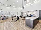 Thumbnail 28 of 29 - A modern office space with a reception desk and multiple seating arrangements.