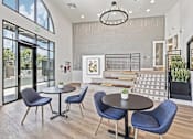 Thumbnail 4 of 29 - A dining area with a table and chairs.