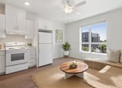 Thumbnail 18 of 18 - A modern kitchen with white appliances at Mainline North Apartments - Santa Clara, CA, California