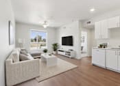 Thumbnail 3 of 12 - A modern living room with a large couch and a flat screen TV.