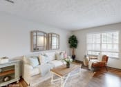 Thumbnail 6 of 46 - a living room with a couch and a coffee table at Island Club Apartments, Ohio