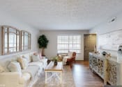 Thumbnail 8 of 46 - a living room with a couch and a table at Island Club Apartments, Columbus, OH, 43235