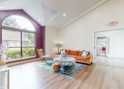 Thumbnail 8 of 24 - community clubroom with orange couch at The Vale, Cordova, 38018