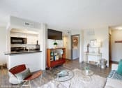Thumbnail 2 of 35 - a living room with a couch and a table and a kitchen at Runaway Bay Apartments, Columbus, OH