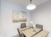 Thumbnail 23 of 46 - a dining room with a wooden table and chairs at Island Club Apartments, Columbus, OH