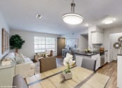 Thumbnail 15 of 46 - a living room and kitchen with a dining room table and chairs and a kitchen at Island Club Apartments, Columbus, OH