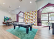 Thumbnail 2 of 24 - community clubroom with pool table and foosball at The Vale Apartments and Townhomes, Cordova