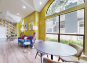 Thumbnail 4 of 24 - a living room with yellow walls and a dining room with a table and chairs at The Vale, Cordova, 38018