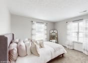 Thumbnail 2 of 46 - a bedroom with a bed and two windows at Island Club Apartments, Columbus, OH