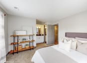 Thumbnail 4 of 46 - a bedroom with a large bed and a bathroom at Island Club Apartments, Columbus, Ohio