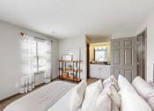 Thumbnail 10 of 46 - a living room with a couch, a bed and a kitchen at Island Club Apartments, Columbus, Ohio