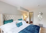 Thumbnail 12 of 35 - a bedroom with a large bed and a mirrored closet at Runaway Bay Apartments, Columbus