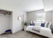 Thumbnail 13 of 46 - a bedroom with two beds and a mirror on the wall at Island Club Apartments, Ohio, 43235