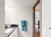Thumbnail 15 of 35 - a bathroom with a sink and a mirror at Runaway Bay Apartments, Columbus, OH, 43204