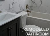 Thumbnail 18 of 25 - Marbled bathroom with a tub and a sink at 275 on the Park Apartments, Missouri
