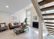 Thumbnail 15 of 24 - a living room with a staircase and a couch and a table at The Vale, Cordova, 38018