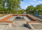 Thumbnail 26 of 35 - a backyard with a fire pit and a fence at Runaway Bay Apartments, Columbus, OH, 43204