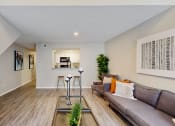 Thumbnail 16 of 24 - a living room with a couch and a table at The Vale Apartments and Townhomes, Tennessee, 38018
