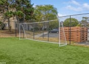 Thumbnail 27 of 35 - a soccer goal in a chain link fence on a grass field at Runaway Bay Apartments, Columbus, OH