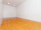 Thumbnail 46 of 46 - A room with wooden floor and white walls at Island Club Apartments, Columbus, 43235