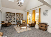 Thumbnail 41 of 46 - A living room with a grey carpet and wooden furniture at Island Club Apartments, Columbus