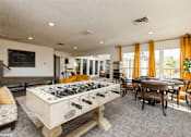 Thumbnail 37 of 46 - A foosball table is in the middle of a living room at Island Club Apartments, Columbus, OH, 43235