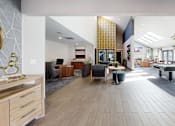 Thumbnail 1 of 20 - A spacious office lobby with a reception desk and seating area.