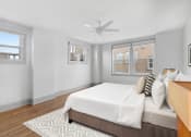 Thumbnail 24 of 25 - A bedroom with a bed and a ceiling fan at 275 on the Park Apartments, Missouri