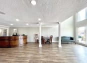 Thumbnail 4 of 12 - a living room with a bar and a dining room at Cambridge Village Apartments, Houston Texas ? 