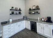 Thumbnail 3 of 17 - a kitchen with white cabinets and a counter top at Whispering Oaks, Conroe, TX 77301 ? 