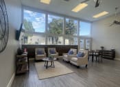 Thumbnail 2 of 17 - a living room with couches and chairs and a large window at Whispering Oaks, Conroe, TX ? 