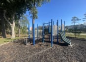 Thumbnail 9 of 17 - a playground with slides and benches in a park at Whispering Oaks, Conroe, TX ? 