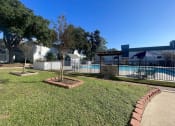 Thumbnail 8 of 17 - a backyard with a swimming pool and a fence at Whispering Oaks, Conroe, 77301 ? 
