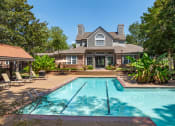 Thumbnail 1 of 9 - a swimming pool with a house in the background at The Grove Germantown Apartments, Germantown, 38138 ?