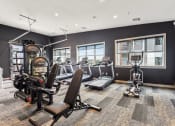 Thumbnail 5 of 35 - the gym with treadmills and weights at the belgard apartments at The Virginia, Seguin