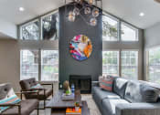 Thumbnail 30 of 42 - Distinguished Lounge Area With Fireplace at Wildwood Apartments, CLEAR Property Management, Texas, 78752