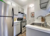 Thumbnail 4 of 42 - Fully Equipped Kitchen with Stainless Steel at Wildwood Apartments, CLEAR Property Management, Austin, TX