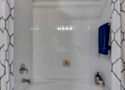 Thumbnail 7 of 22 - a tub and a shower curtain at The Grand at Stonecreek, Texas