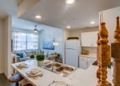 Thumbnail 7 of 65 - Living Room With Kitchen View at Aviator at Brooks Apartments, San Antonio, 78235
