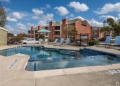 Thumbnail 40 of 42 - Outdoor Swimming Pool at Wildwood Apartments, CLEAR Property Management, Texas, 78752