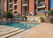 Thumbnail 23 of 42 - Pool With Sunning Deck at Wildwood Apartments, CLEAR Property Management, Austin, 78752