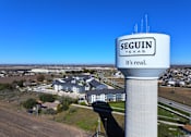 Thumbnail 35 of 35 - A water tower with the word "SEGUIN" on it.