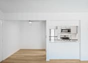 Thumbnail 27 of 42 - A kitchen with a stove top oven and a sink at Water Ridge Apartments , Irving