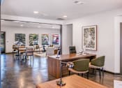 Thumbnail 8 of 42 - A conference room with a long table and chairs at Water Ridge Apartments , Texas, 75061