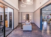 Thumbnail 7 of 42 - A modern living room with a marble floor and a large white sofa at Water Ridge Apartments , Texas, 75061